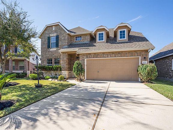 The home features a stacked stone elevation, and established landscaping. Certified as Environments for Living Home that include