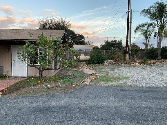 Gravel parking lot by home