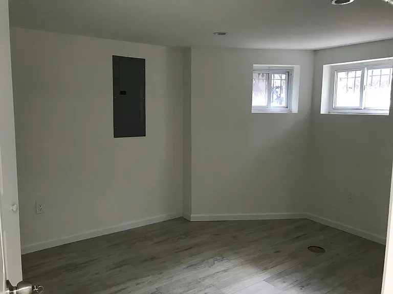 bedroom one with closet and windows above the ground