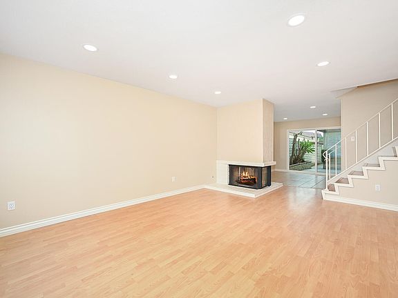 Living Room has laminate flooring and recessed lighting.