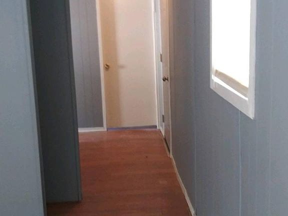 Hallway to bedroom and bathroom.