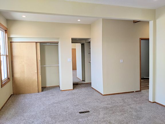Large bedroom has 2 closets with dressing area on one side