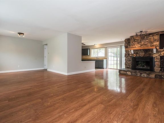 Walk in to a large open floor plan! Large Living Room, Dining room/Breakfast room with wood burning fireplace.  Kitchen has freshly painted cabinets and new stainless appliances.