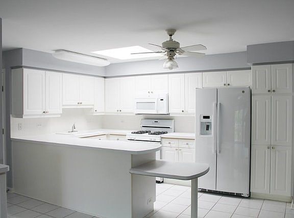 Beautiful White Cabinetry, New Hardware and Pull Out Shelves