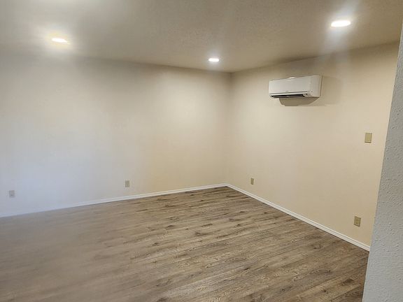 Living room with view of courtyard and covered patio