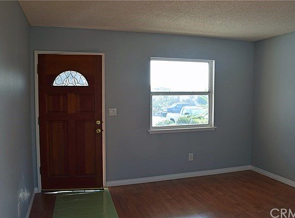 Nice front door, new wood laminate floors