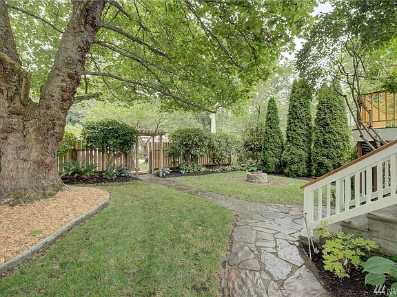 Lots of greenery & character in this front yard!