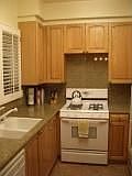 Kitchen with granite countertops and a view of the courtyard.