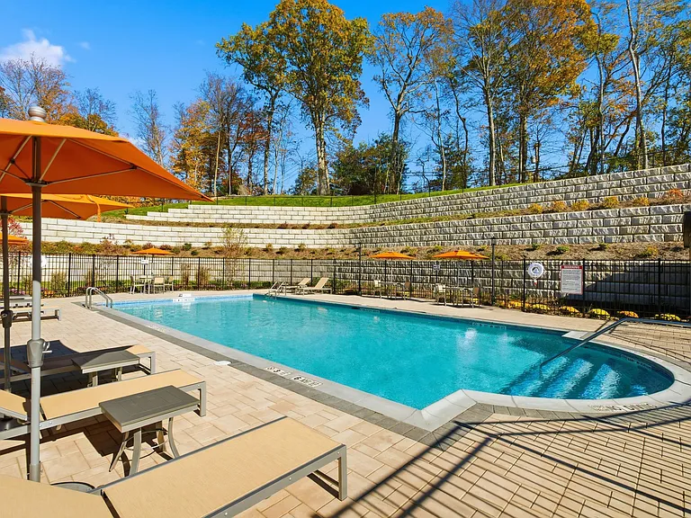 Relax and unwind at Eagle Rock Apartments at Woodbury, where a stunning pool awaits you. Enjoy sun-drenched days and tranquil evenings in a beautifully designed outdoor oasis. Schedule your visit today and make this haven your new home!