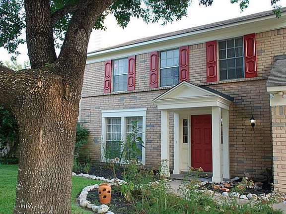 Well maintained front covered entrance. Beautiful red door.