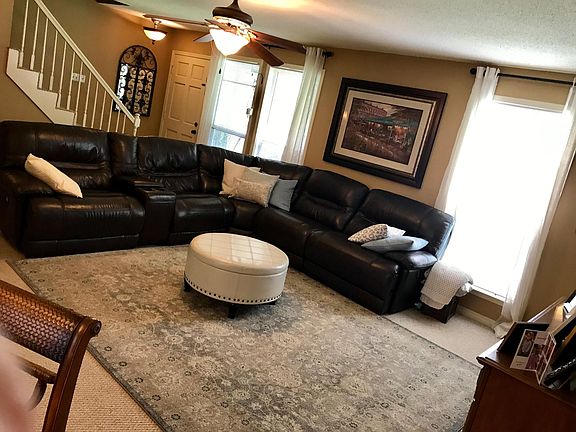 Open floor plan, living area w/ wood burning fireplace
