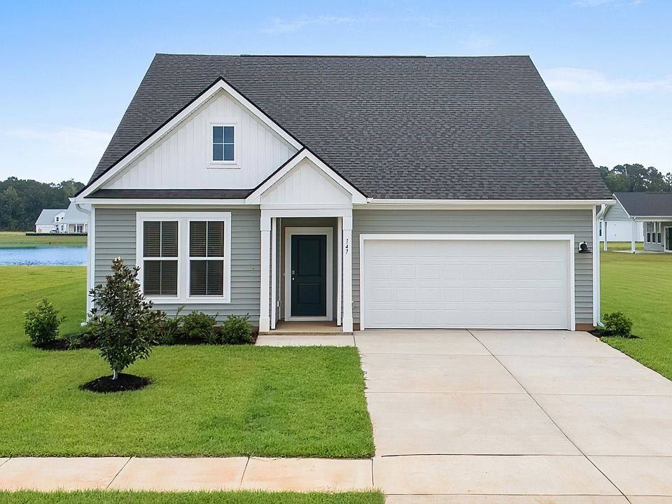 Avondale Elevation 2 at Chestnut Farms in Longs, SC featuring charming front porch, gable roofline,
