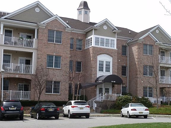 The Entrance to the Ardsley building has both steps plus a ramp if needed. All the buildings here are attractively constructed of Brick, and Vinyl, offers elevators, & An Assigned spot in the Parking Garage, with your Private, keyed storage unit. 