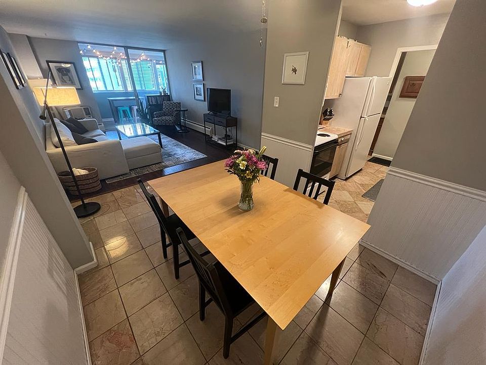 Dining toom looking into living room and kitchen