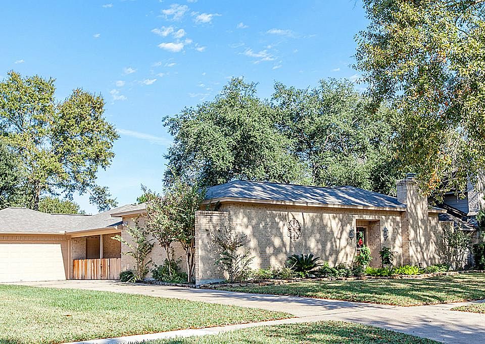 Garage looks detached but is actually atttached to back of home.