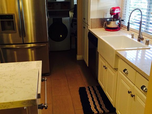Oversized farmhouse sink and new tiled floors