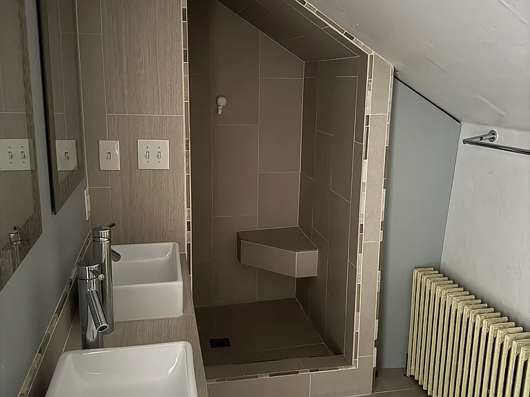 The radiant heat creates a warm and cozy space to shower in the winter!
