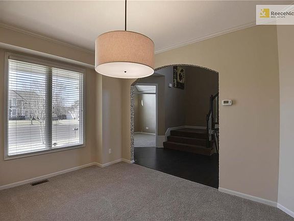 Brand new carpet, fresh paint & new light fixture in this dining room.