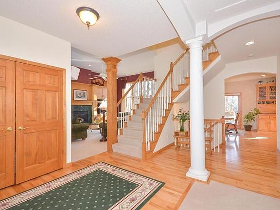 Quality of construction abounds in this custom built home - hardwood floors, six panel doors, majestic pillar and soaring windows in the family room flood the home in sunlight.