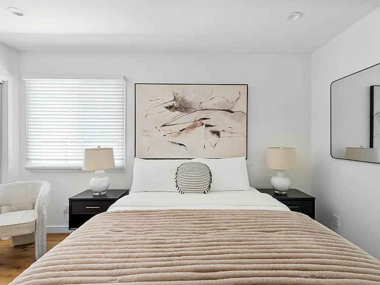 Primary bedroom suite with queen bed
