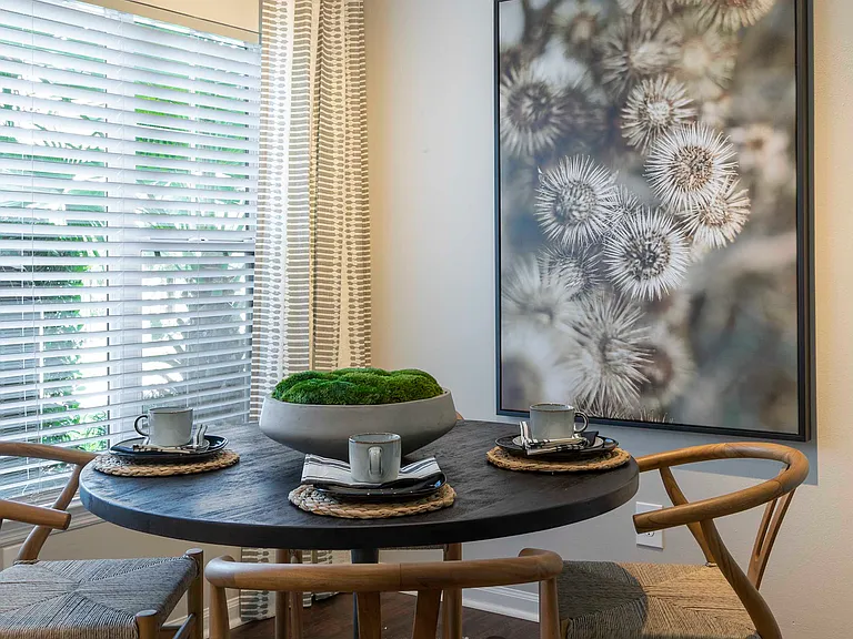 Bright dining area with crown molding