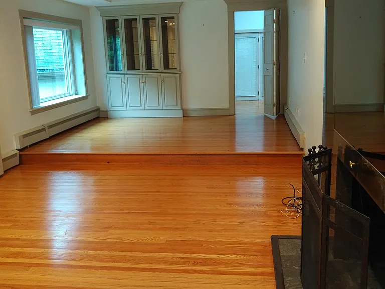 Living room with fireplace and dining area and china cabinet