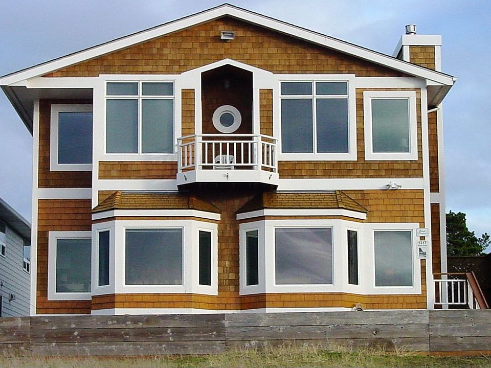 1317 N Prom's handsome cedar shingled with wide trim exterior