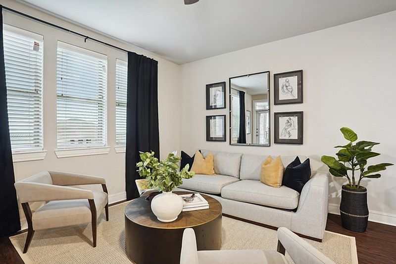 Living room with large windows and hardwood floor
