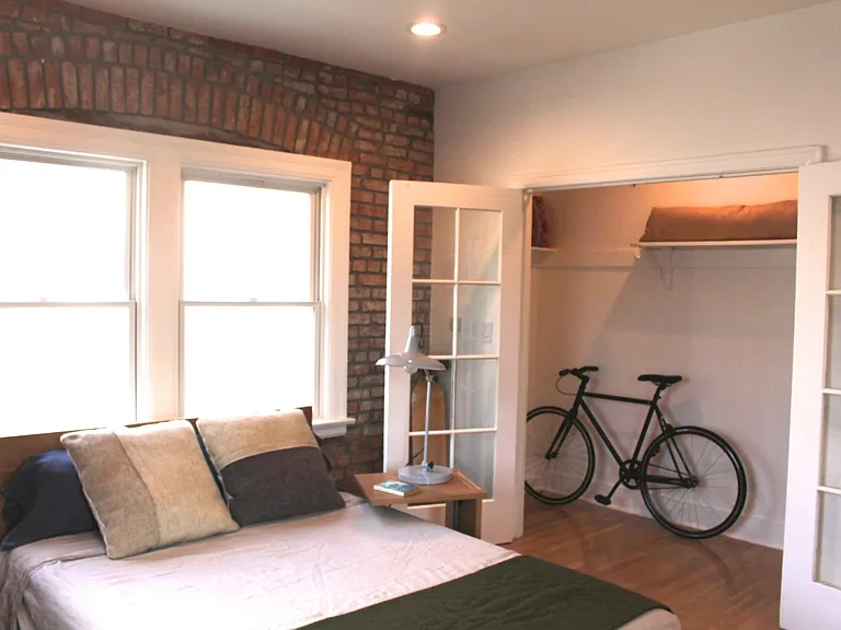 Closet view from bedroom. Staged