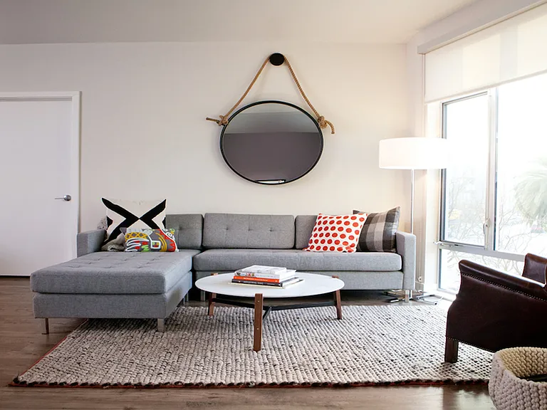 Lover of natural light? This open living area features floor to ceiling windows