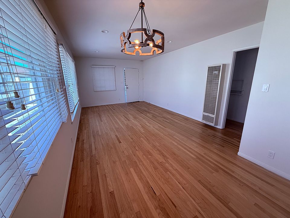 Open Dining Area to Living Room with Hardwood Floors
