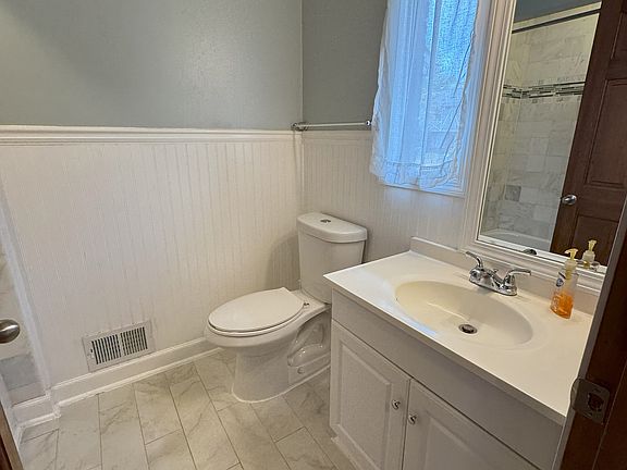 Downstairs full bath with marble shower.