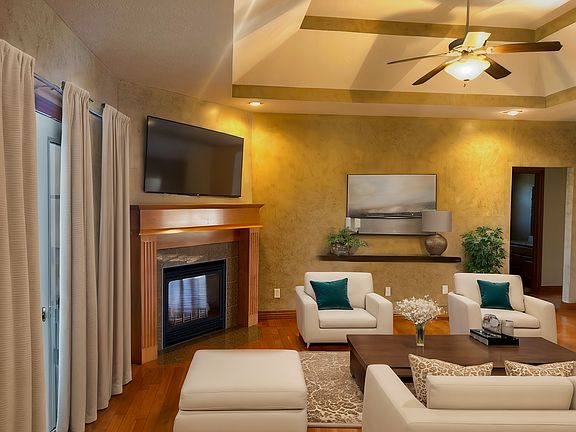 Spacious living room off of the kitchen with gorgeous hardwood flooring.