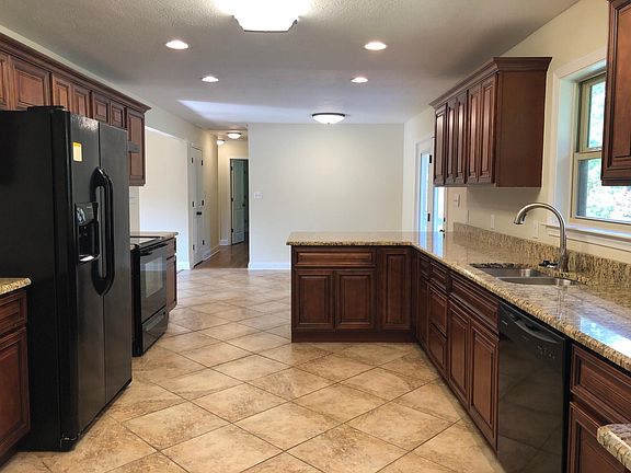 Kitchen view from door to attached 2 car garage