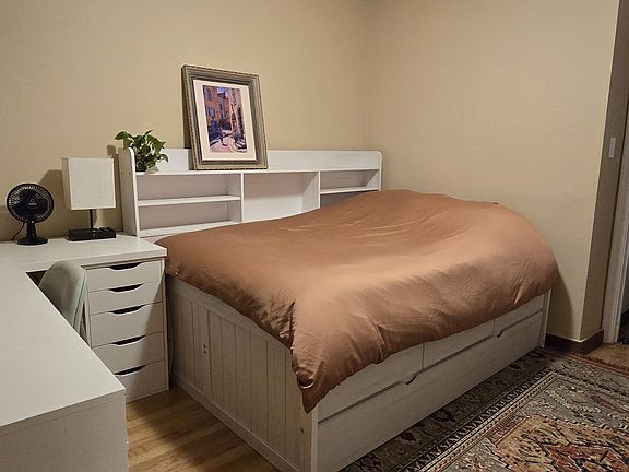 It is completely furnished with a new bed(s) & bedframe with lots of shelf and drawer space. There is a twin bed that slides out from underneath.