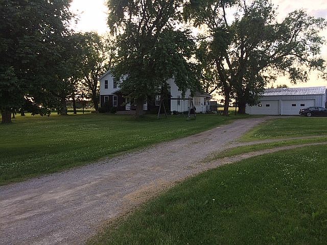 Farmhouse, garage and shop. 