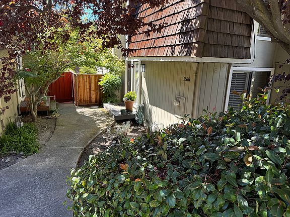 Landscaped, secluded front door to townhome. Stairs or level entry walk.