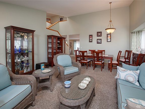 Formal living room with vaulted ceiling
