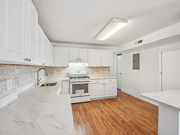 Remodeled kitchen with Quarts counter tops.