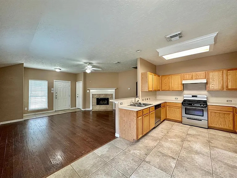 Very large living room and kitchen with ten ft ceilings.