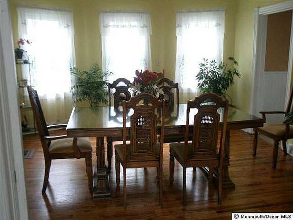 Spacious Dining room  with new bow windows and hard wood floors