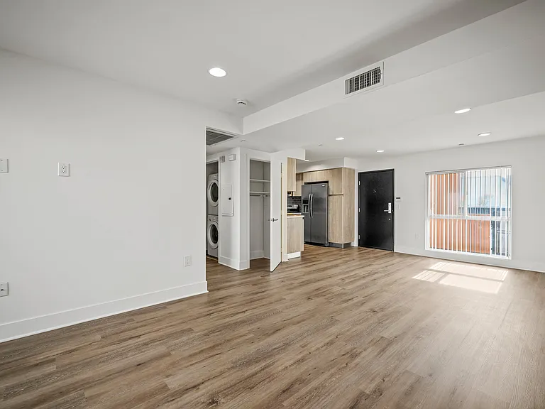 Living room view to dining and kitchen
