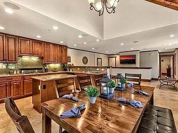 This well-equipped shared kitchen boasts modern appliances and ample counter space, perfect for cooking and entertaining. Its open design allows for easy flow into the living area, making it a great spot for gatherings and family meals.