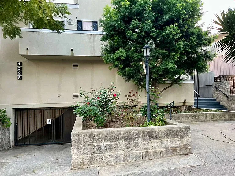 Front of the complex, underground garage on left, stair entry on right