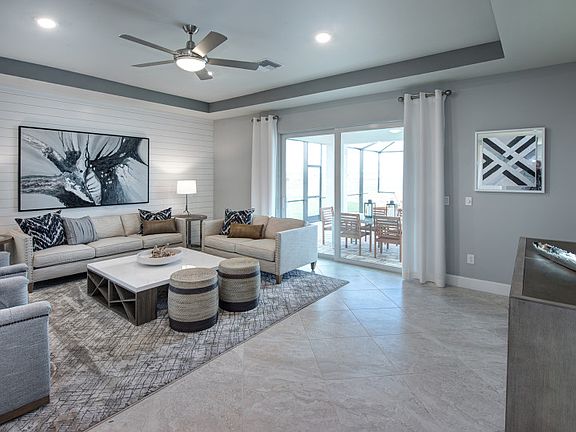 Spacious gathering room with sliding glass door to the covered lanai