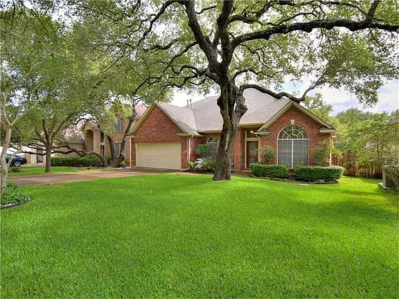 Beautifully treed front yard.