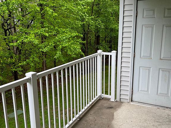 outside private balcony facing woods
