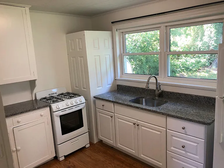 All new Kitchen: New oven, sink, counter tops, and refrigerator