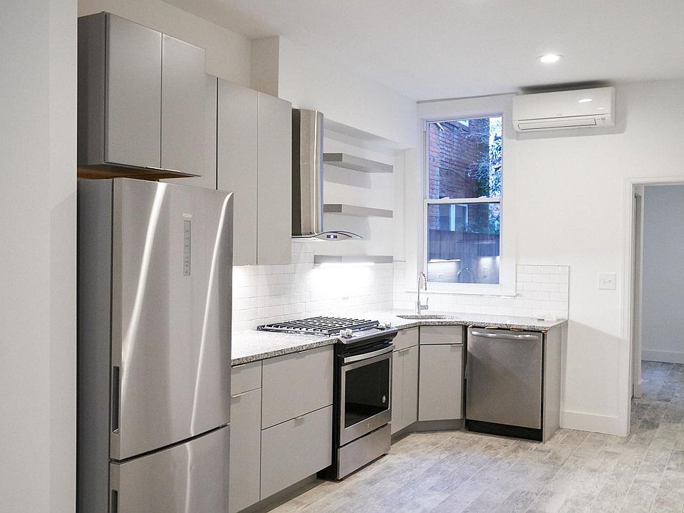 Thoughtfully designed new kitchen with granite countertops, gas range