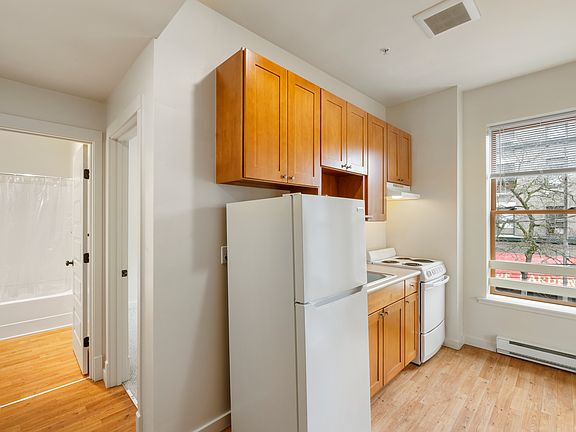 2-bedroom apartment kitchen with stove, oven, refrigerator, microwave